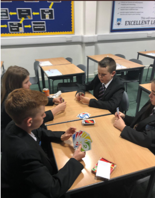 Image of students playing uno